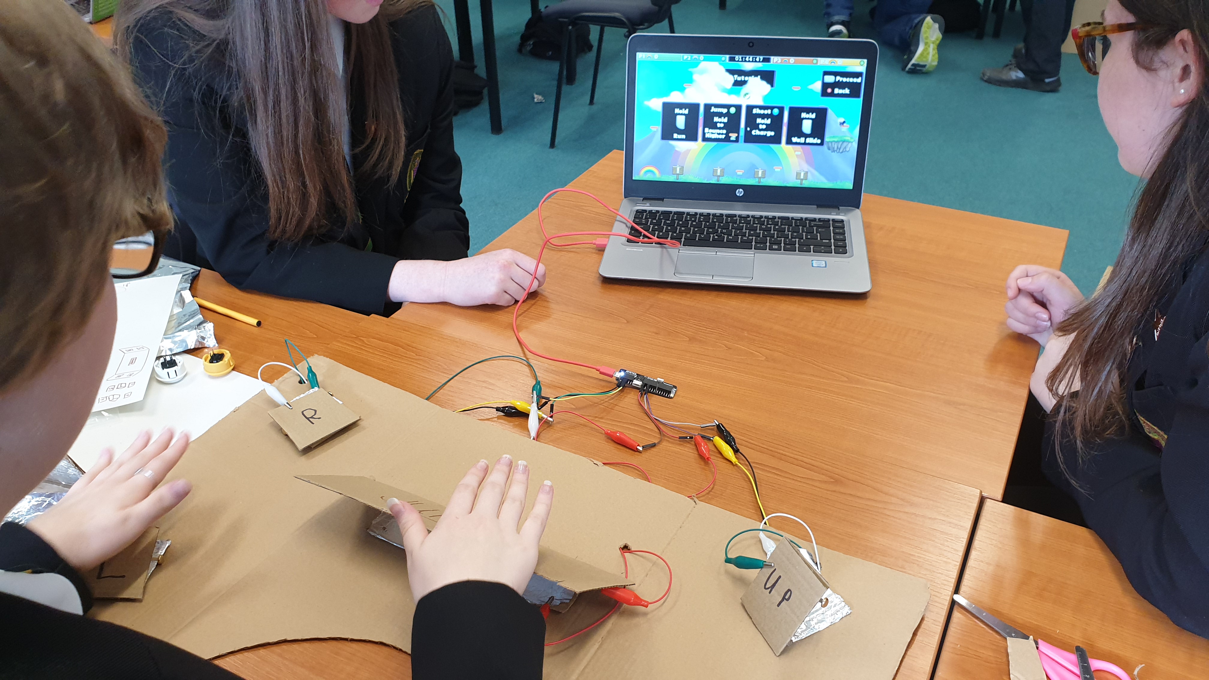 Cardboard controller being used to play online games